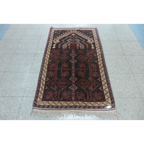 137 - A Persian Nomadic Belouch rug, 78 x 135cms