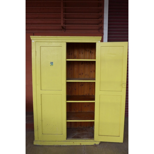 150 - An early 20th Century painted pine housekeeper's cupboard, 191cma h, 119cms w, 44cms d