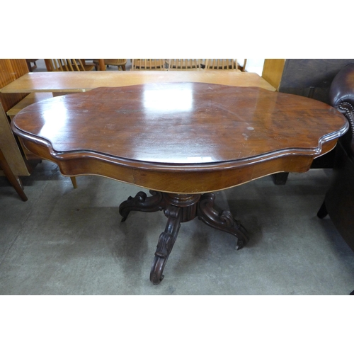 152 - A Victorian style mahogany serpentine centre table