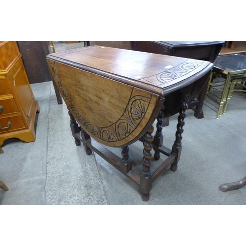 156 - An early 20th Century carved oak barleytwist gateleg table