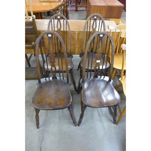 162 - A set of four beech Windsor kitchen chairs
