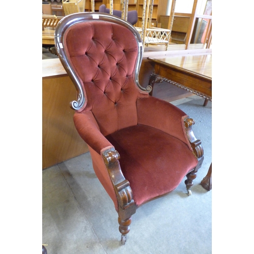 168 - A Victorian mahogany and burgundy fabric upholstered armchair