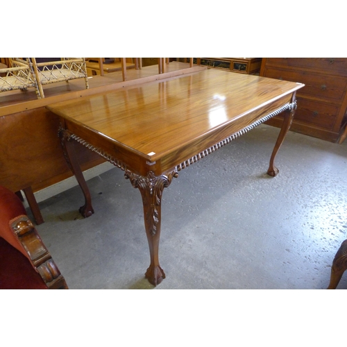 169 - A Chippendale style mahogany dining table