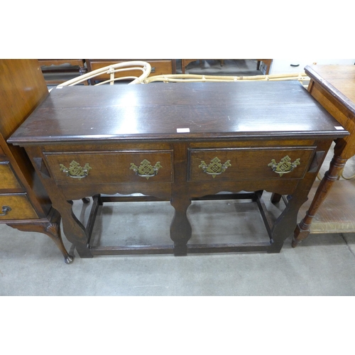 178 - A small George III style oak two drawer dresser