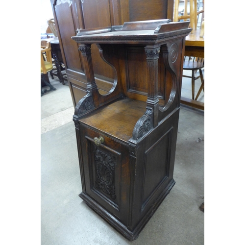 184 - A Victorian carved oak purdonium, made by Garrett & Sons, Warrington