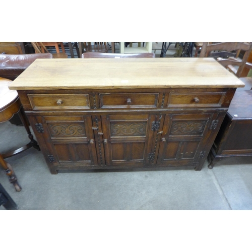 186 - A 17th Century style carved oak dresser