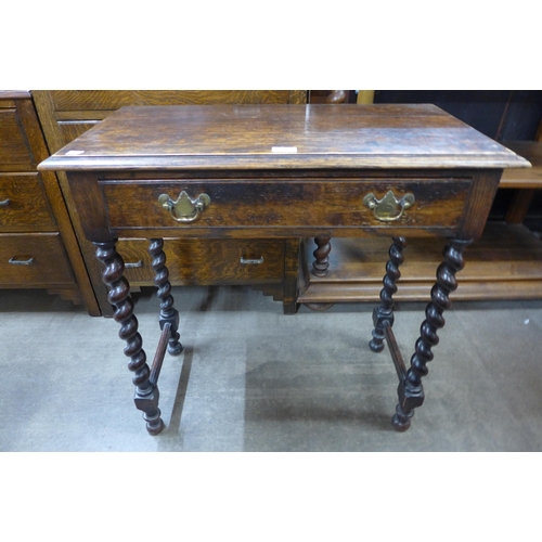 190 - An 18th Century and later oak barleytwist single drawer side table