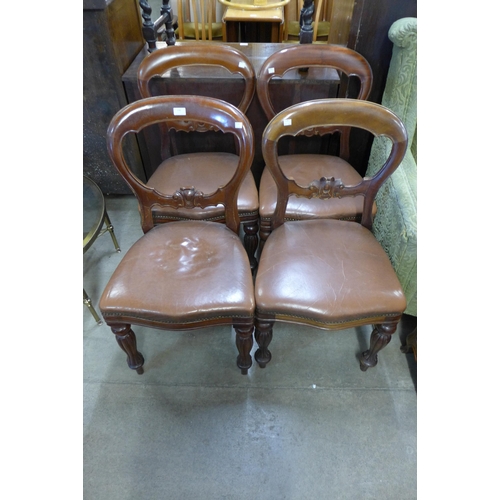 198 - A set of four Victorian carved mahogany balloon back dining chairs