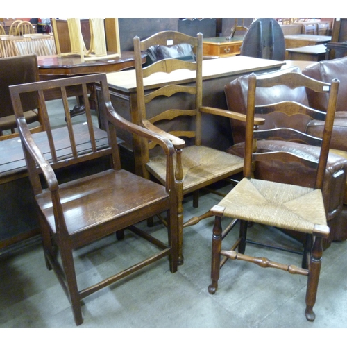 200 - A pair of Arts and Crafts elm rush seated ladderback chairs and one other