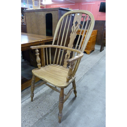 203 - A Victorian elm and beech highback Windsor armchair