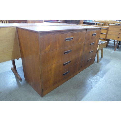 21 - A teak chest of drawers