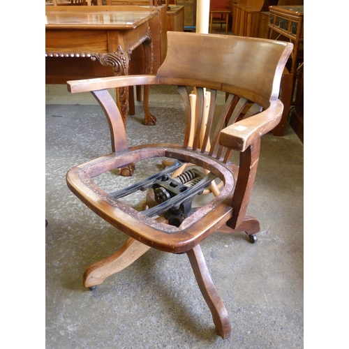 217 - An early 20th Century mahogany revolving desk chair