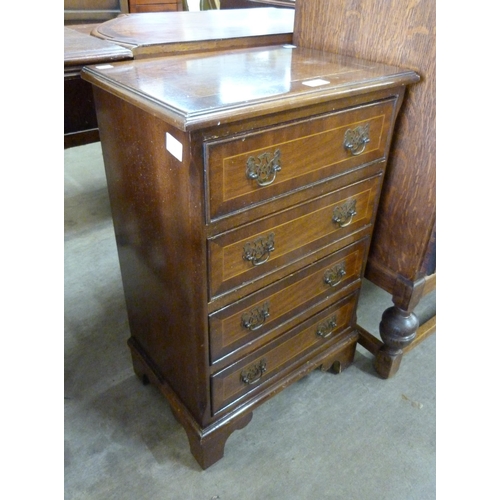 221 - A small inlaid mahogany chest of drawers