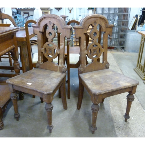 226 - A pair Victorian Gothic Revival Thomas Simpson mahogany hall chairs