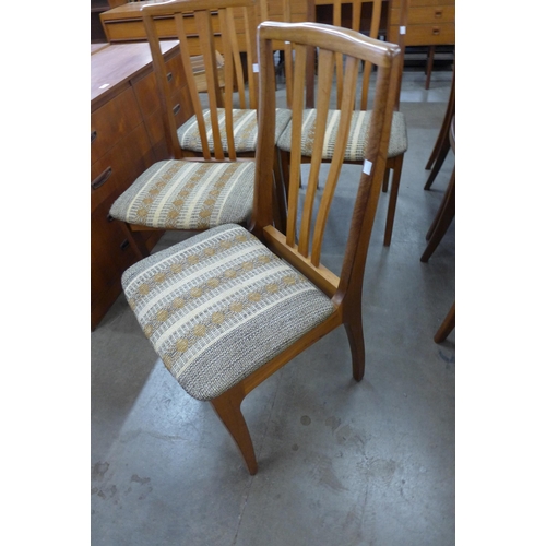24 - A set of four teak dining chairs