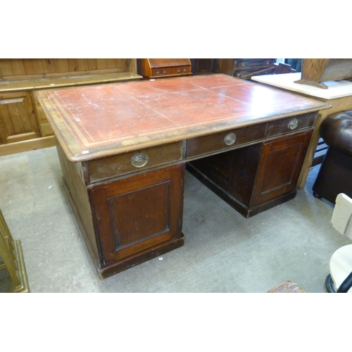 241 - A Victorian mahogany and red leather topped partners desk