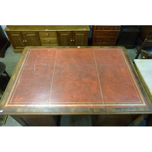 241 - A Victorian mahogany and red leather topped partners desk