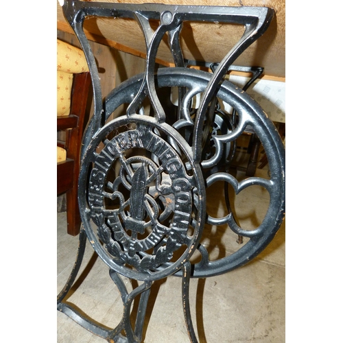 256 - A Singer mahogany and cast iron based pub table