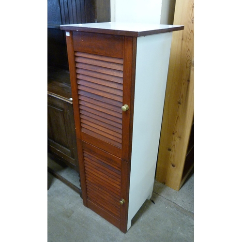 265 - A painted mahogany two door cupboard