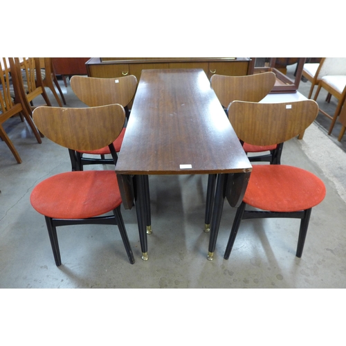 27 - A G-Plan Librenza tola wood and black drop leaf table and four butterfly-back chairs