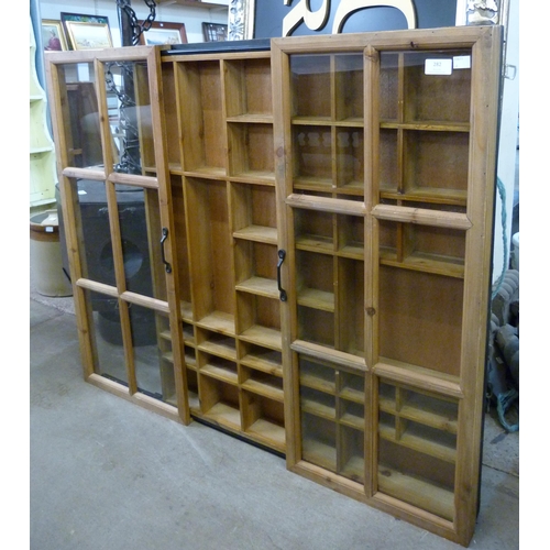 282 - A beech wall mounted two door display case