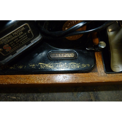 287 - An oak cased Singer sewing machine