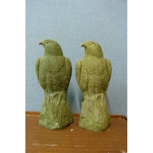 296 - A pair of concrete garden figures of birds of prey