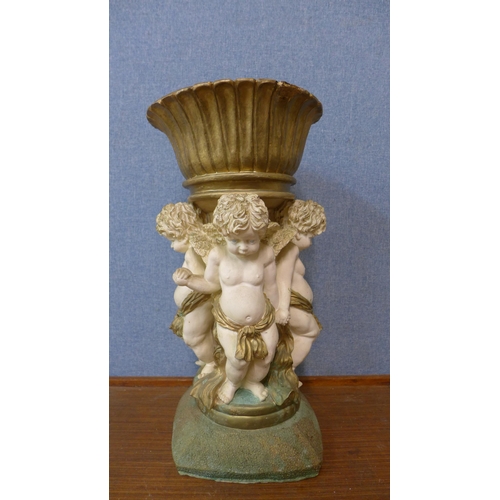 338 - An Italian style painted cherub planter