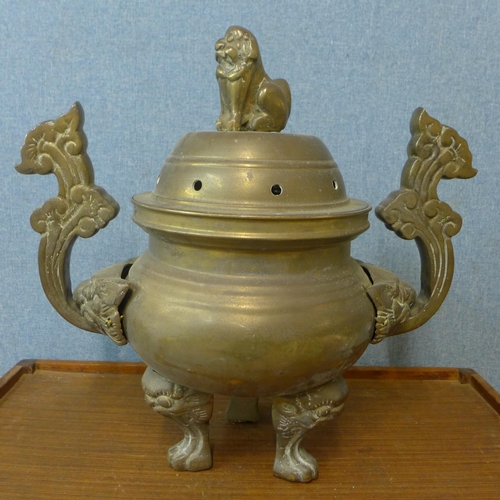 348 - An oriental bronze censer and cover