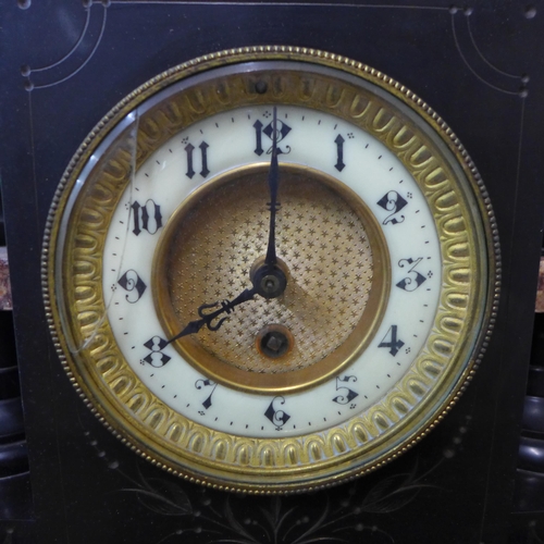 360 - A 19th Century French Belge noir mantel clock