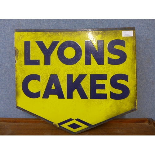 372 - A vintage double sided Lyons Cakes enamelled sign