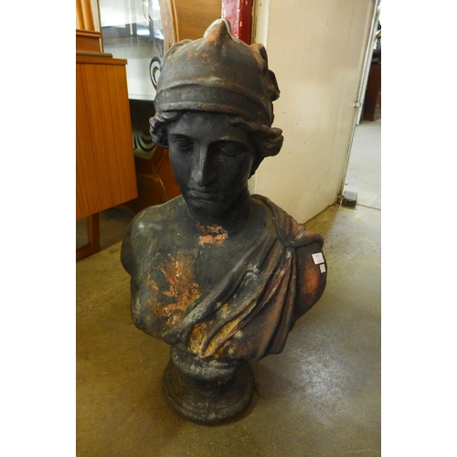 379 - A cast iron bust of a Roman man