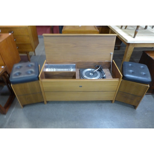 49 - A teak stereogram with Garrard turntable, two speakers and assorted records