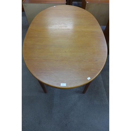 70 - A Jentique teak extending dining table