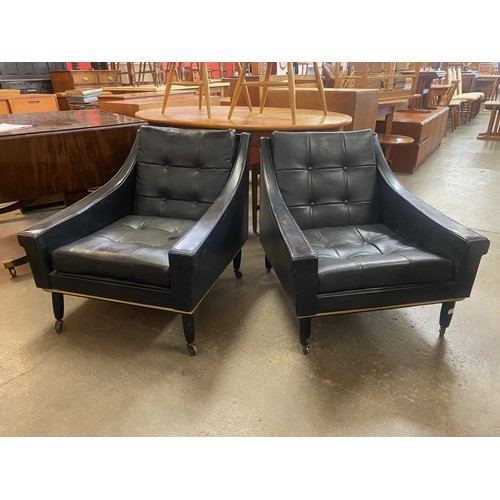 64 - A pair of Stonehill of London black leather cocktail chairs