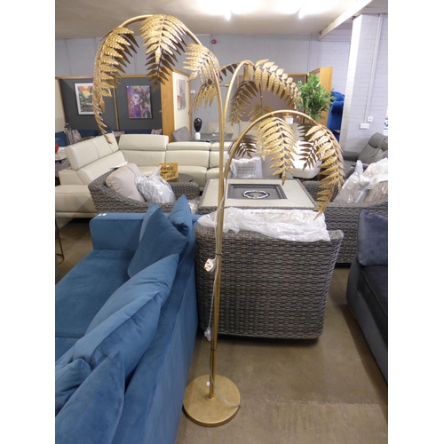 1394 - A gold floor standing palm lamp