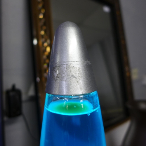 1509 - A silver and green lava lamp