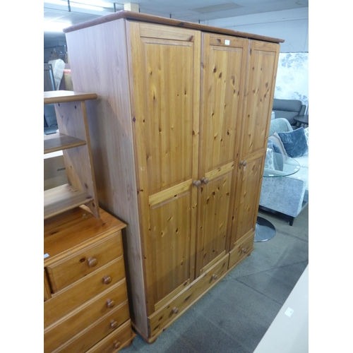 1571 - A pine triple wardrobe - slight marks