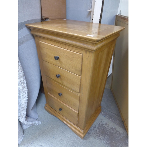 1621 - A natural oak 4 drawer tallboy