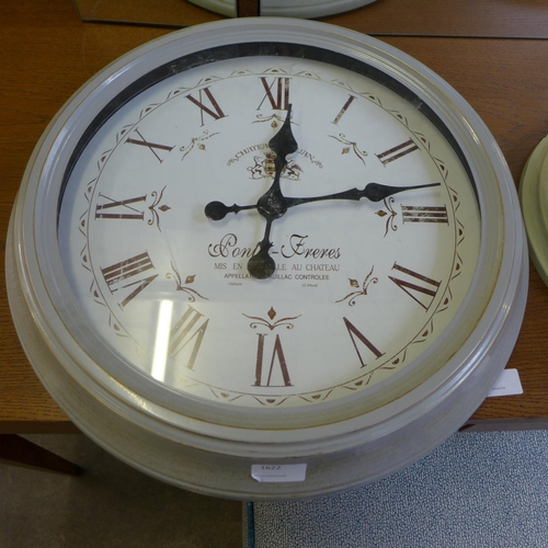 1622 - A set of two grey and cream Roman numerals wall clocks