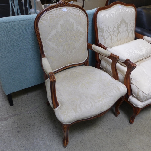 1625 - An oak and cream patterned upholstered armchair