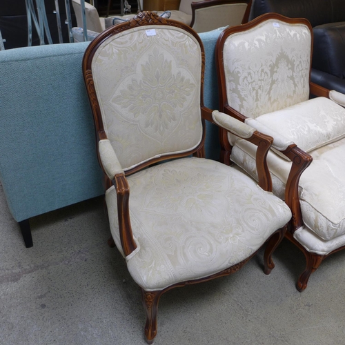 1625 - An oak and cream patterned upholstered armchair