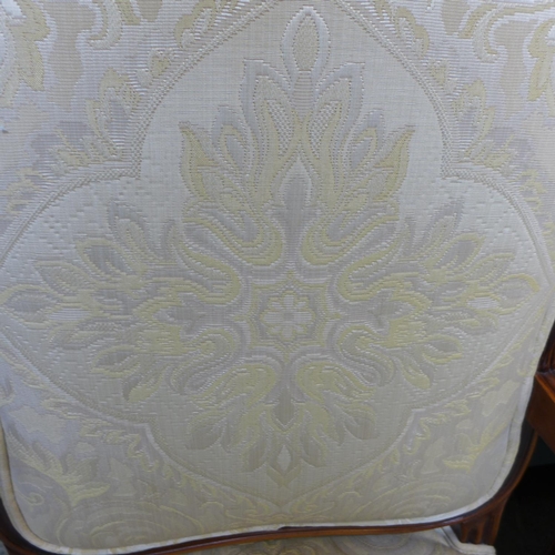 1625 - An oak and cream patterned upholstered armchair