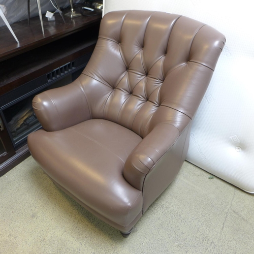 1648 - A Wade upholstery brown leather button back armchair