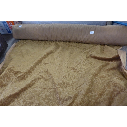 2302 - Roll of gold coloured textile fabric