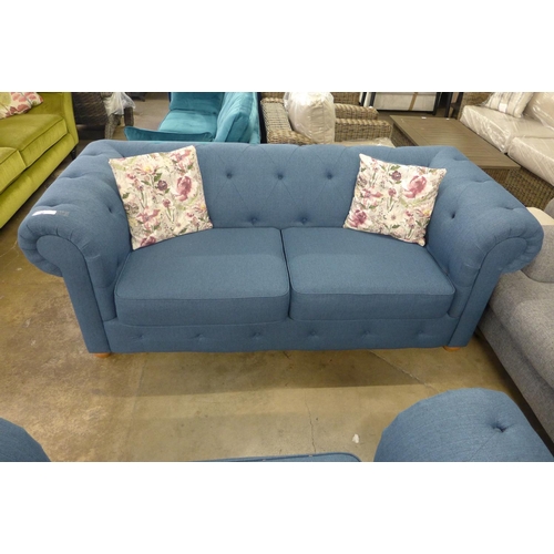 1437 - A navy blue textured weave Chesterfield style three seater sofa and loveseat