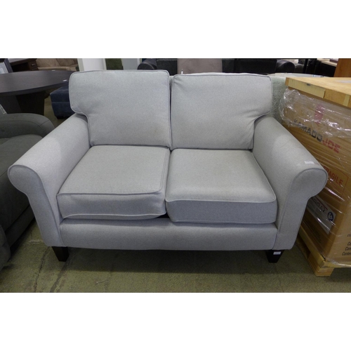 1559 - A grey upholstered two seater sofa