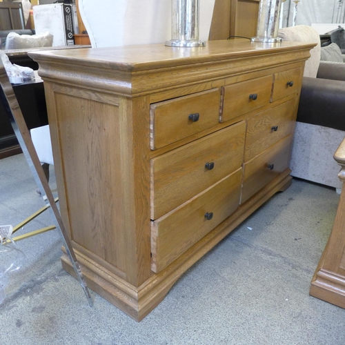 1606 - A natural oak 3 over 4 chest of drawers