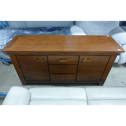 1633 - A hardwood three drawer, two door sideboard - marked