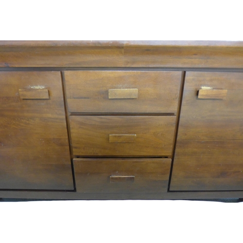 1633 - A hardwood three drawer, two door sideboard - marked